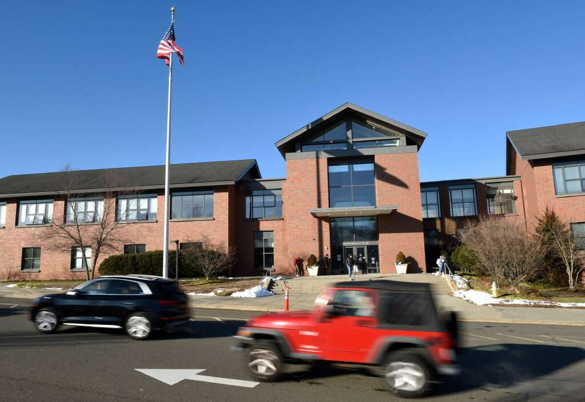 Students are dismissed at the end of the school day at Darien High School in Darien, Conn. Tuesday, Jan. 11, 2022. Darien High School students can receive counseling services at the school this weekend after officials said a tragedy and loss occurred.