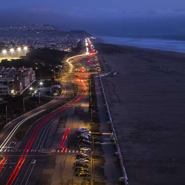 Traffic moves along the Great Highway and Ocean Beach in San Francisco, Calif., on Monday, March 28, 2022. Despite the area being a haven for those looking to have fun and get some fresh air, a recent analysis of data from Purple Air sensors shows that the area has some of the highest air pollution in the city.
