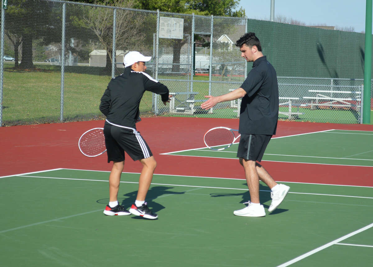 Jade Dynamic (left) and Michael Karibian (right) won 8-2 against Maine South on Friday at the Edwardsville Tennis Center. 