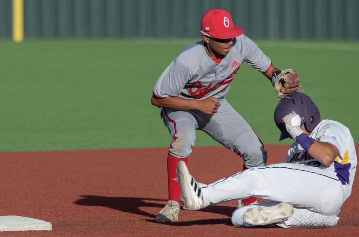Midland High's Jacob Urias is tagged out at second by Odessa High's Jaime Madrid 04/01/2022 at Zachery Field. Tim Fischer/Reporter-Telegram