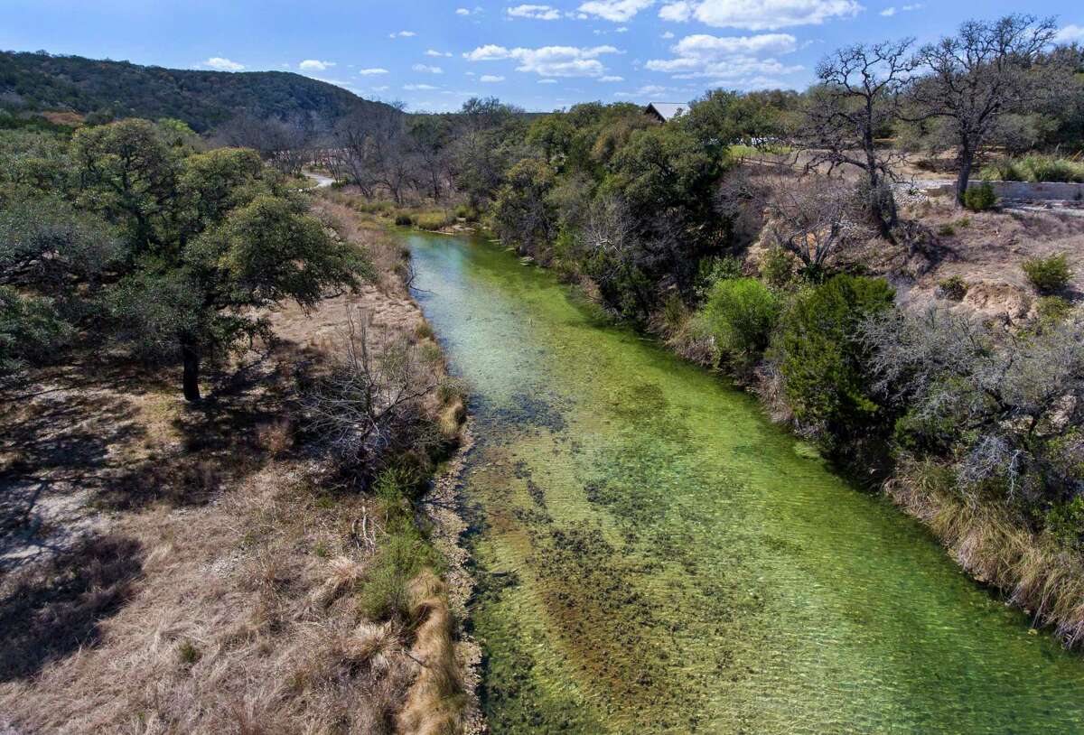 Algae blooms in upper Cibolo Creek as it runs through largely undeveloped land between the creek’s headwaters and Boerne City Lake.