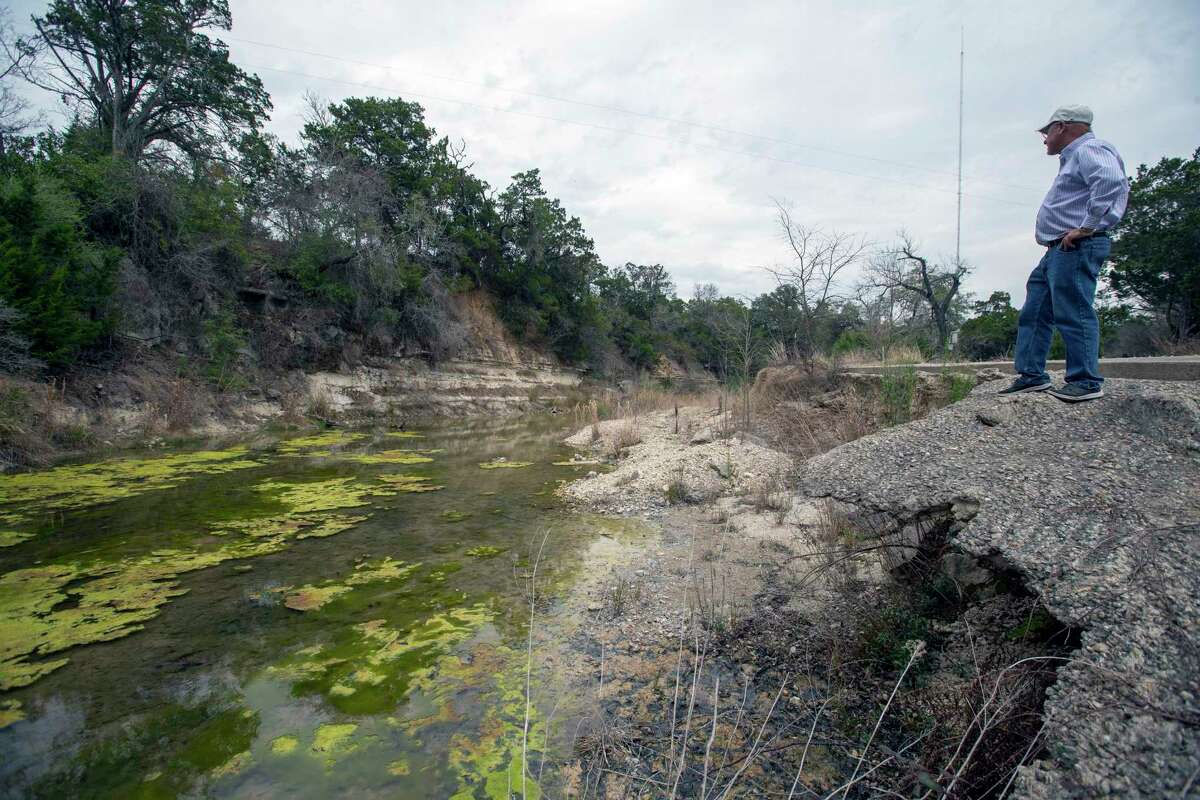 Milan J. Michalec, president of the Cow Creek Groundwater Conservation District, looks Tuesday, March 29, 2021, at Cibolo Creek upstream of Boerne City Lake.