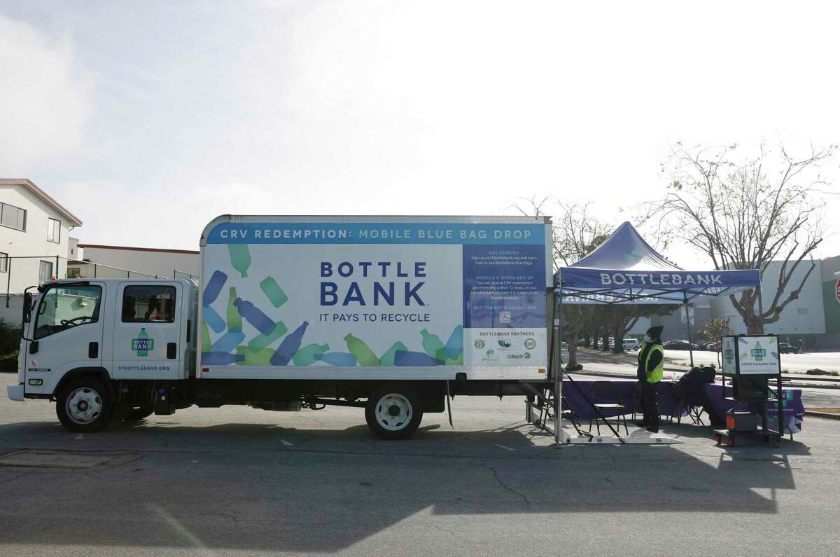 Bottle Bank's mobile recycling truck is seen next to a Bottle Bank canopy at the mobile drop-off location at Stonestownon Shopping Center on Thursday, March 31, 2022 in San Francisco, Calif.