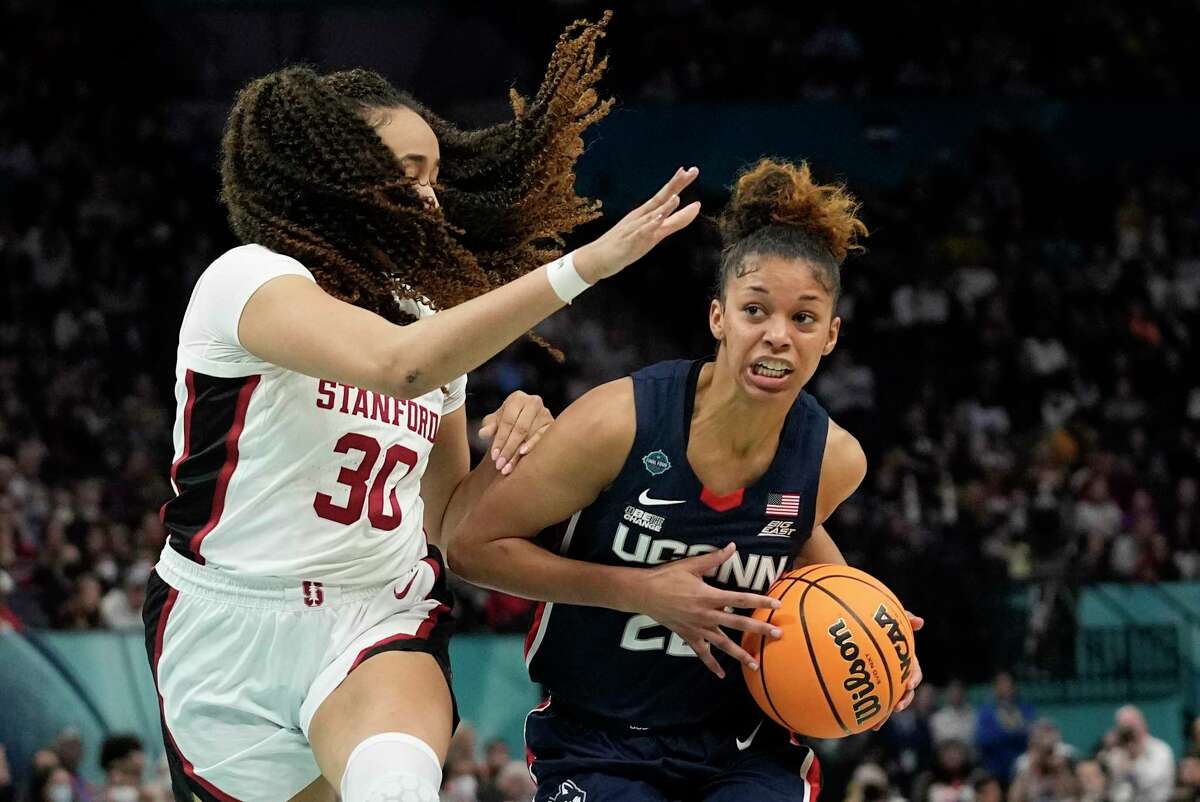 UConn's Evina Westbrook tries to get past Stanford's Haley Jones during the second half of a college basketball game in the semifinal round of the Women's Final Four NCAA tournament Friday, April 1, 2022, in Minneapolis. (AP Photo/Eric Gay)