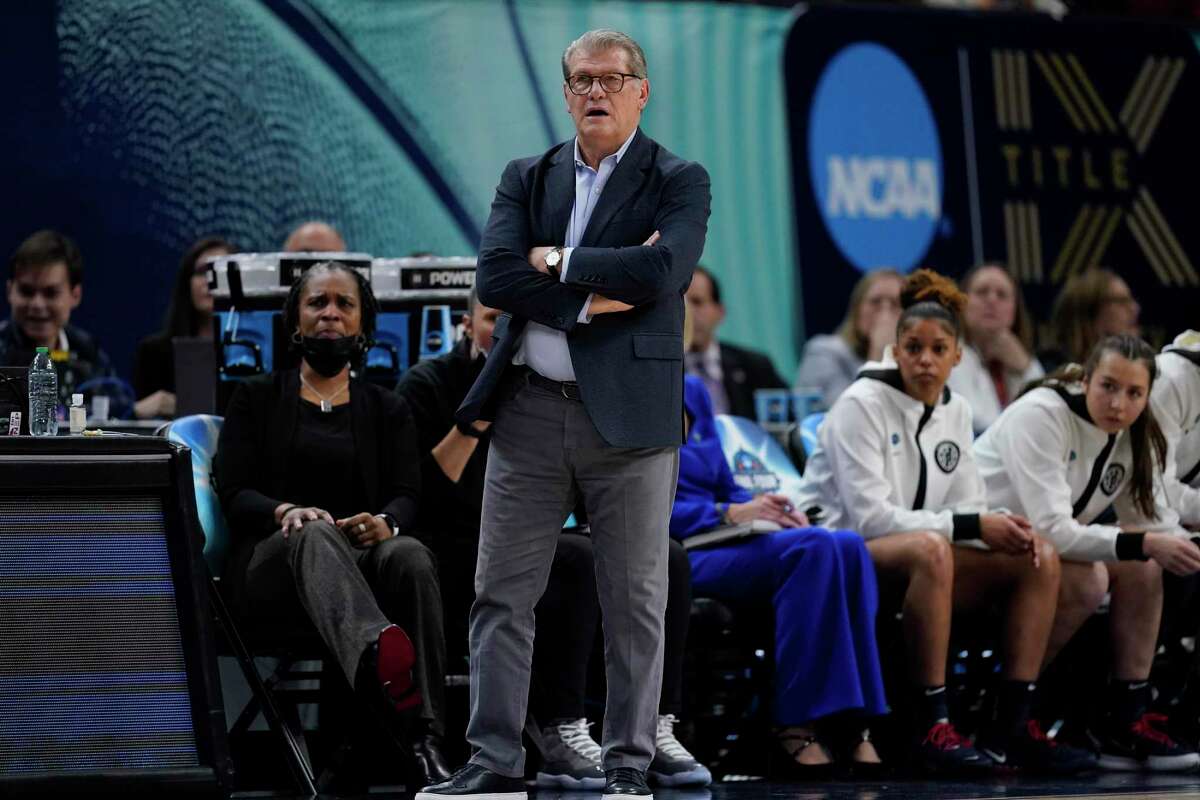 UConn head coach Geno Auriemma watches during the first half of a college basketball game in the semifinal round of the Women's Final Four NCAA tournament Friday, April 1, 2022, in Minneapolis. (AP Photo/Charlie Neibergall)