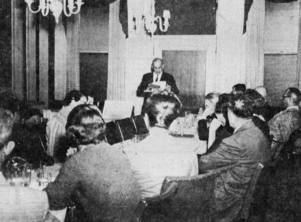 Floyd Clement, local realtor addresses the Paul Bunyan Board of Realtors at the Hotel Chippewa yesterday during their all-day seminar. About 30 realtors and sales staff people were on hand for the seminar from a four-county area. The photo was published in the News Advocate on April 5, 1962.