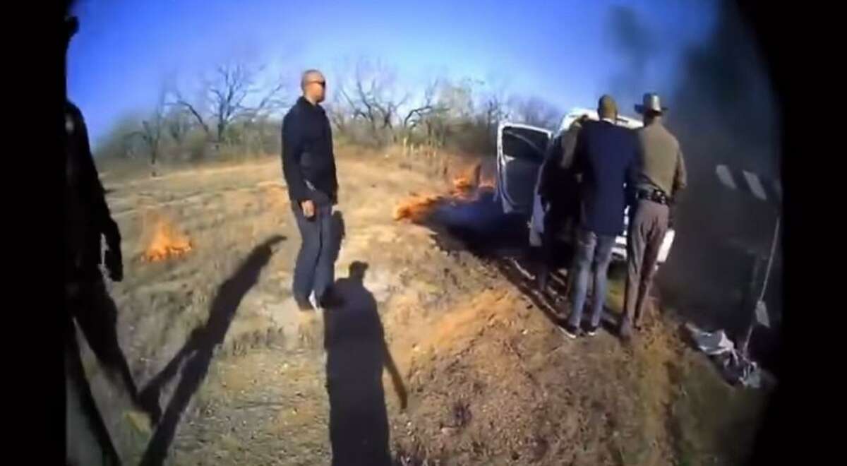 Body cam footage from a Texas Department of Public Safety trooper shows authorities rescuing a migrant from a burning vehicle. She was inside a duffle bag.