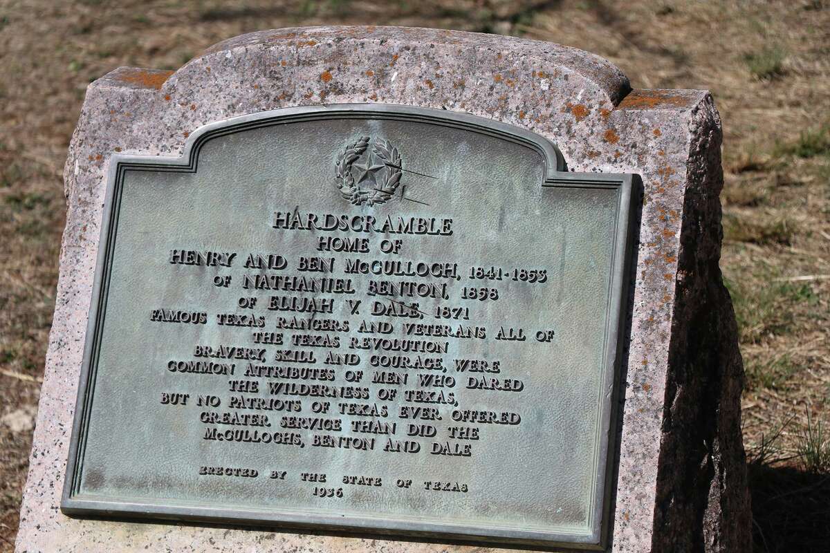 A history plaque sits in front of the Hardscramble Ranger Station that served as the home to some of the first Texas Rangers.