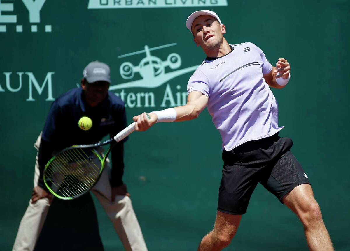 Casper Ruud returns a serve in the first set from Christian Garin during the singles finals of the US Men's Clay Court Championships at River Oaks Country Club in Houston, TX on Sunday, April 14, 2019.