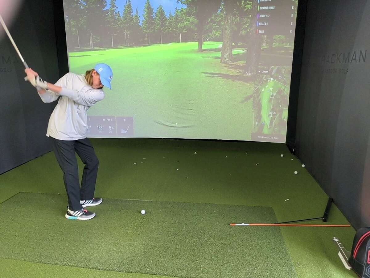 Brayden Dock of Queensbury practices on one of the simulators at Anders Mattson Golf. Dock, who qualified for the Drive, Chip and Putt national finals for a second straight year, has been working with Anders Mattson, owner/founder of the Saratoga Springs studio, since 2019.