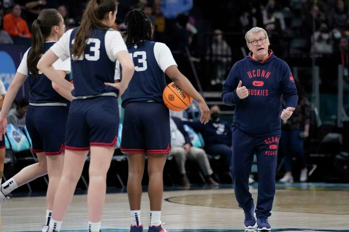UConn head coach Geno Auriemma talks to some players during a practice session for a college basketball game in the final round of the Women's Final Four NCAA tournament Saturday, April 2, 2022, in Minneapolis. (AP Photo/Charlie Neibergall)