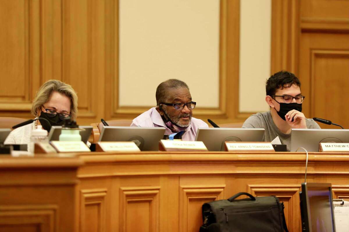 Rev. Arnold Townsend, center, speaks during a task force hearing at San Francisco City Hall on Saturday, April 2, 2022, in San Francisco, Calif. Folks are upset about a conversation splitting up District 6 between the Tenderloin and SOMA.