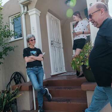 Sharon Dolan (left), housemate Dylynn Berrows and Dolan’s ex-husband, Stefan Schneider, chat in front of Dolan’s house.