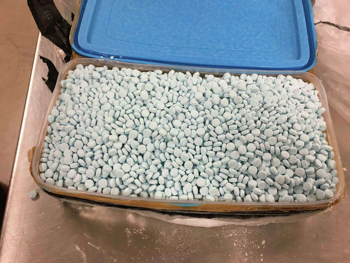 FILE - This Aug. 2017 photo provided by the U.S. Drug Enforcement Administration's Phoenix Division shows one of four containers holding some of the 30,000 fentanyl pills the agency seized in one of its bigger busts in Tempe, Ariz. As the number of U.S. overdose deaths continues to soar, states are trying to take steps to combat a flood of the drug that has proved the most lethal -- illicitly produced fentanyl.(Drug Enforcement Administration via AP, File)