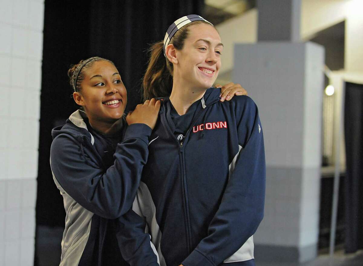 UConn players Kaleena Mosqueda-Lewis, left, and Breanna Stewart walk back to the locker room after answering questions from reporters at a press conference at the Times Union Center Friday, March 27, 2015 in Albany, N.Y. UConn takes on Texas in the NCAA women's tournament tomorrow. (Lori Van Buren / Times Union)