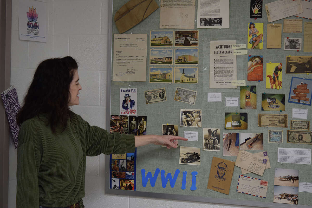 Lisa Hall's classroom features a display about World War II that includes items from Camp Ellis in Fulton County, the site of a prisoner of war camp that held German prisoners. 