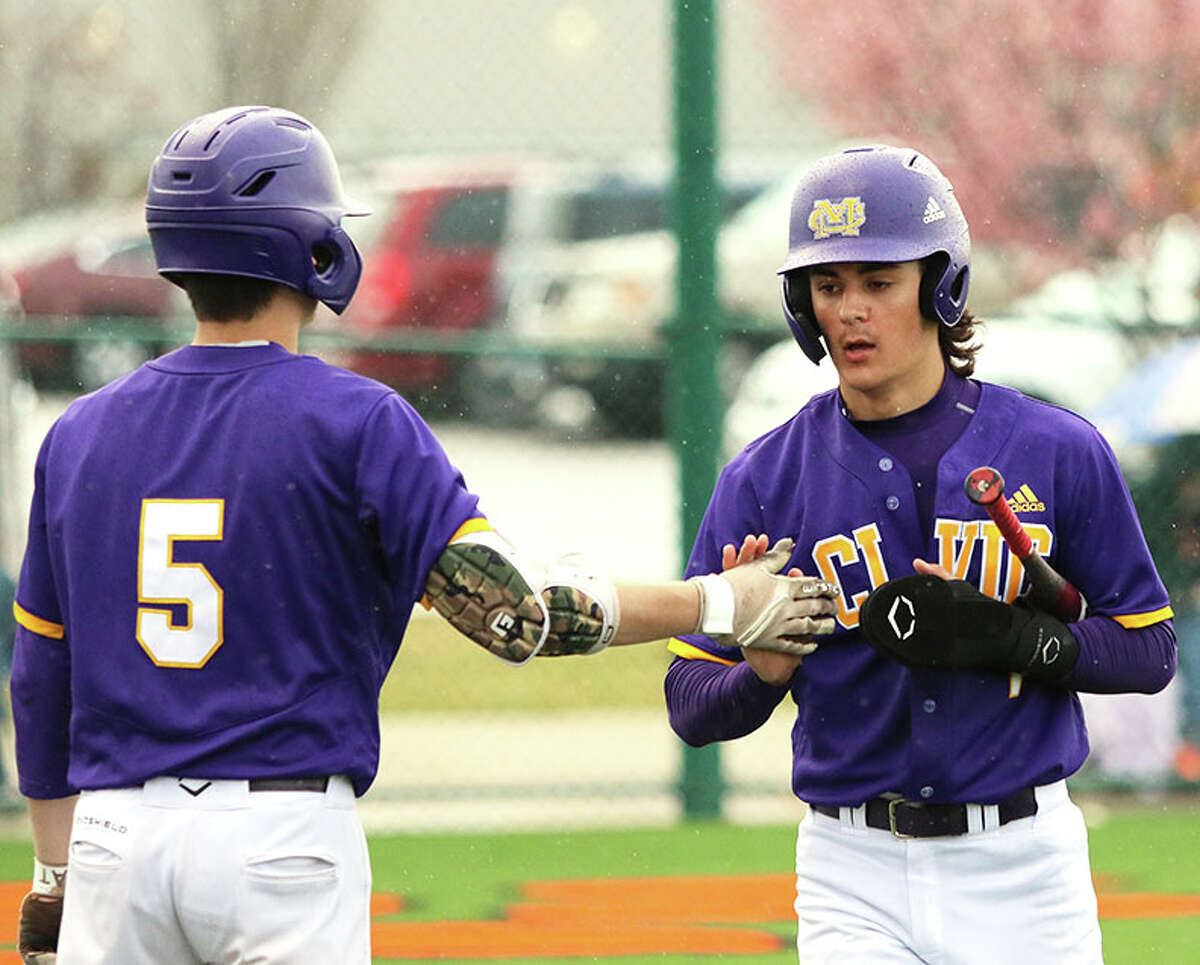 CM's Bryer Arview, right had two hits Thursday against Father McGivney, but his team dropped an 11-3 decision. He is shown earlier this season being greeted by his brother Braden Arview (5) after scoring a run.