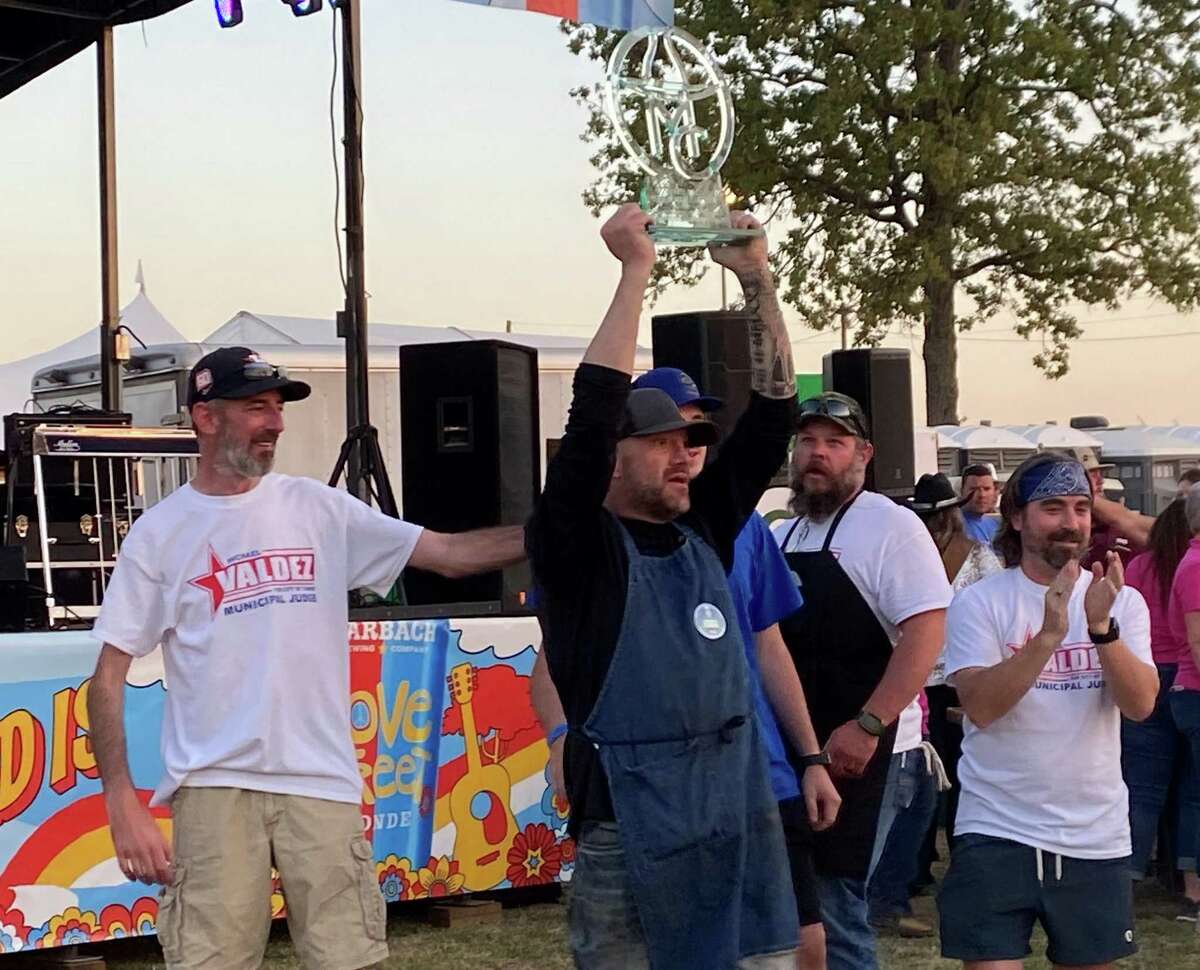 The Montgomery County Fair's Love Street Blonde BBQ Cook-off awards were handed out Saturday night at the fair with the Hogs and Kisses team taking the top prize. Members of Hogs and Kisses hold the trophy high after their win.