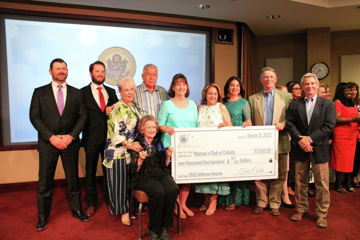 2022 Jefferson Award Winner Dorothy Kinsel (sitting) of the Woman's Club of Cotulla is awarded $1,500 dollars with members of the club and her family.