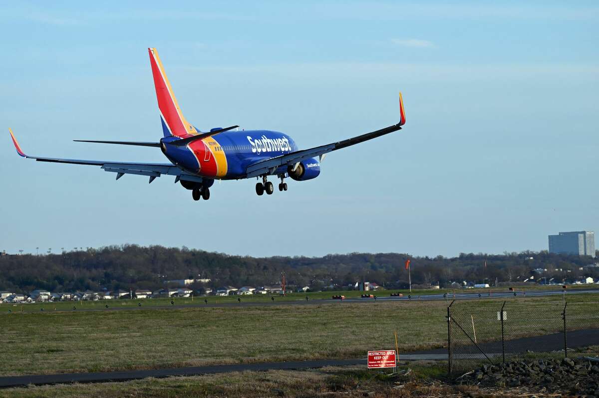 A Southwest Airlines plane approaches the runway at Ronald Reagan Washington National Airport in Arlington, Va., on April 2. Thousands of flight delays and cancellations were reported nationwide over the weekend amid a surge in travel demand. 