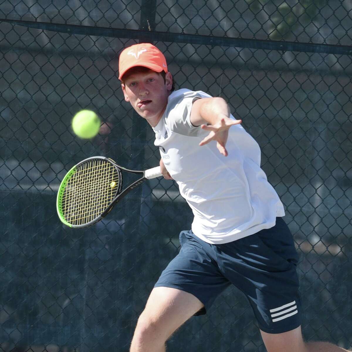 Staples' Tighe Brunetti lines up a shot against Darien's Chris Calderwood at No. 1 singles during the FCIAC boys tennis final in Wilton on Tuesday, May 25, 2021.
