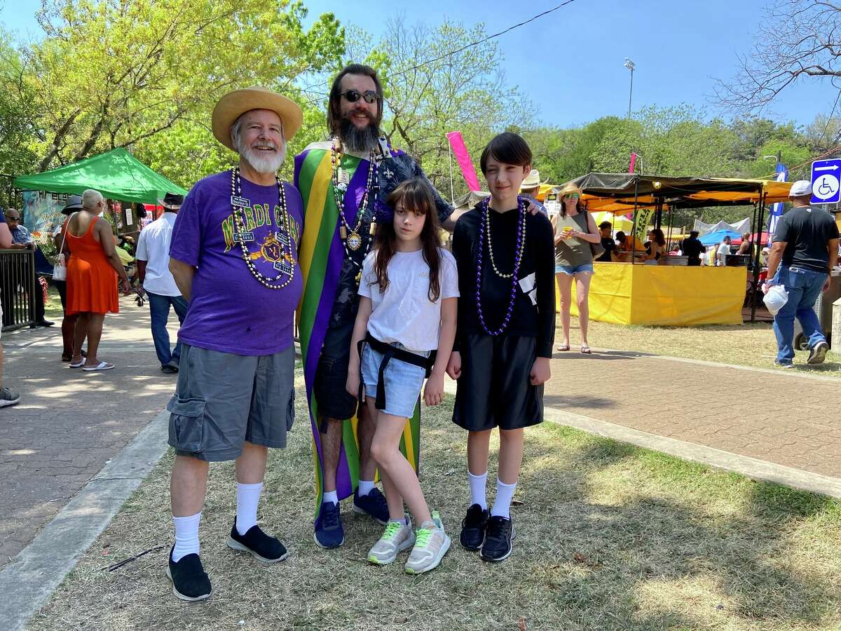 Keith LaRose, 74, with his son Justin LaRose, 41, and grandchildren Kenley, 10, and Xander, 12 at A Taste of New Orleans. The three-day Fiesta event is sponsored by the San Antonio Zulu Association at the Sunken Garden Theater.