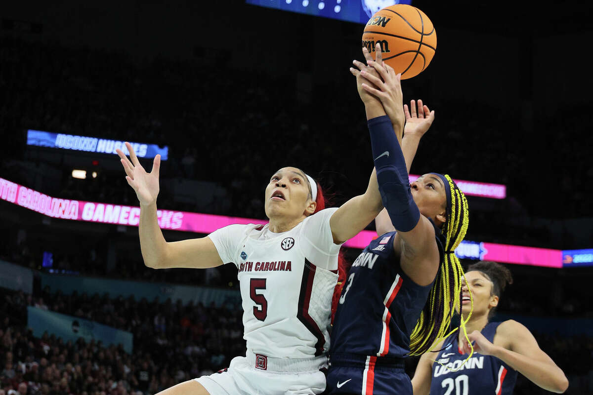 Victaria Saxton of the South Carolina Gamecocks and Aaliyah Edwards of the UConn Huskies battle for a rebound during the first quarter during the 2022 NCAA Women's Basketball Tournament National Championship game at Target Center on April 03, 2022 in Minneapolis, Minnesota.