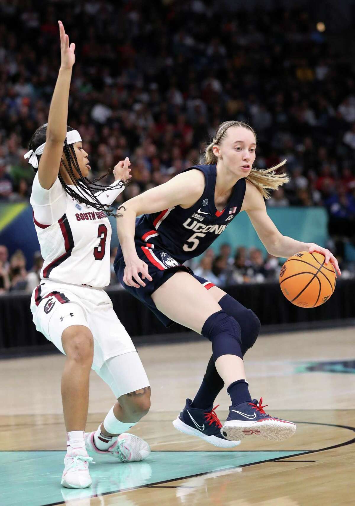 UConn?•s Paige Bueckers dribbles against South Carolina?•s Destanni Henderson in 2nd quarter during NCAA Division 1 Women?•s Basketball Championship Game at Target Center in Minneapolis, MN on Sunday, April 3, 2022.