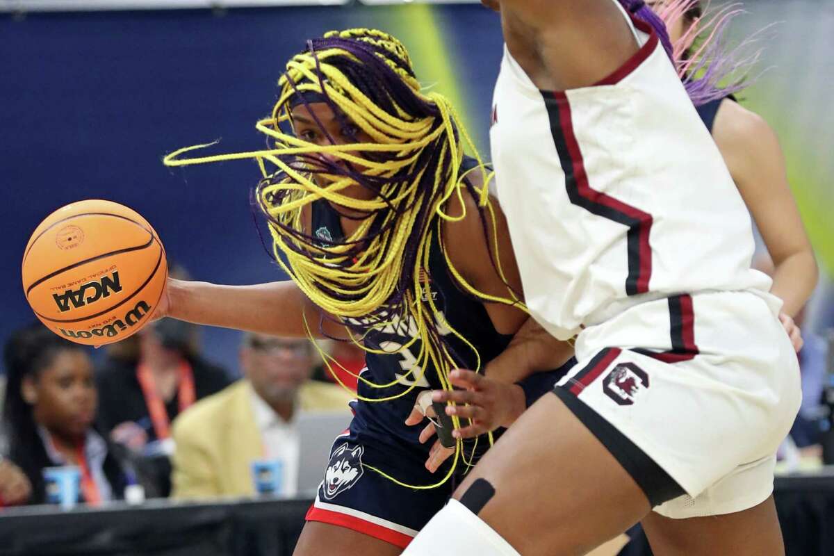 UConn?•s Aaliyah Edwards drives to the basket against South Carolina?•s Aliyah Boston in 1st quarter during NCAA Division 1 Women?•s Basketball Championship Game at Target Center in Minneapolis, MN on Sunday, April 3, 2022.
