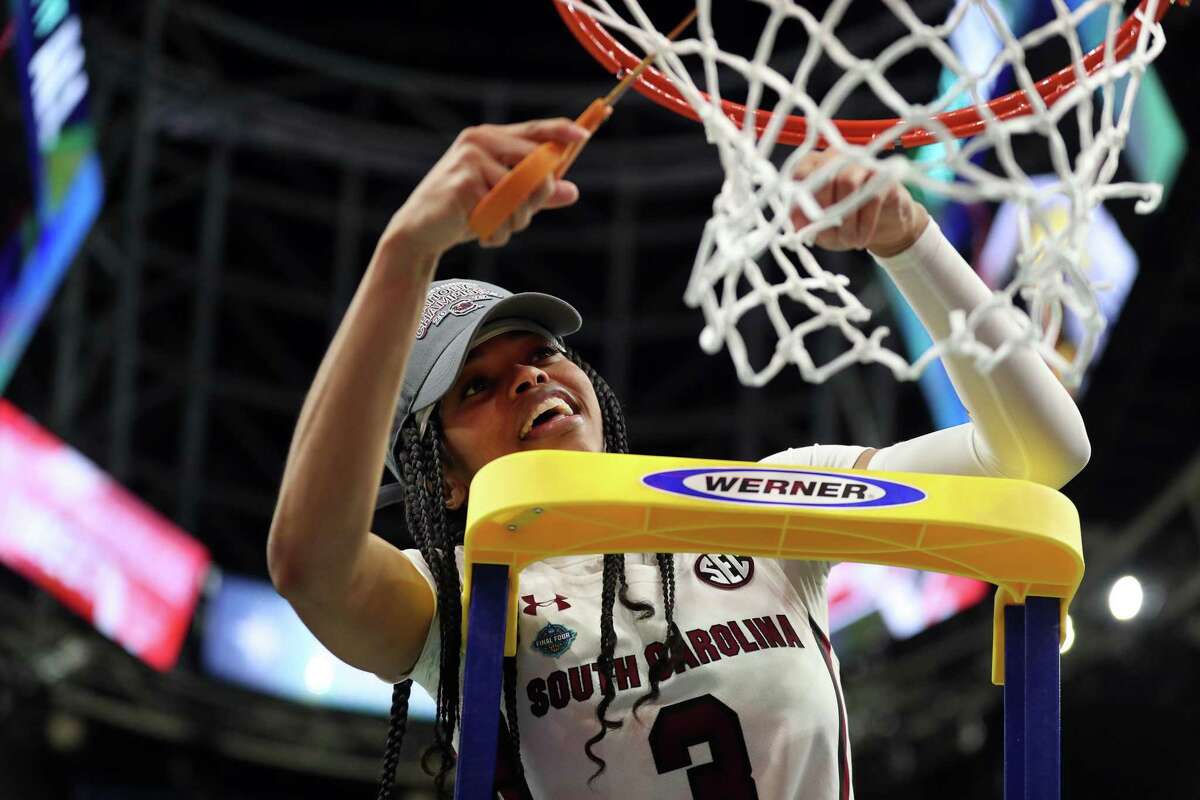 South Carolina’s Destanni Henderson cuts down the net after scoring 26 points in Gamecocks’ 64-49 win over UConn in NCAA Division 1 Women’s Basketball Championship Game at Target Center in Minneapolis, MN on Sunday, April 3, 2022.