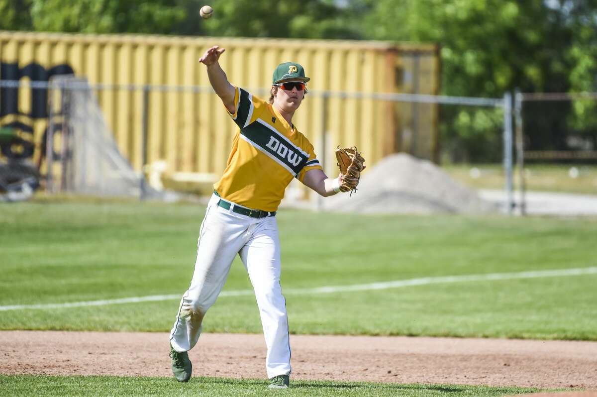 Dow High's Jack Bakus throws the ball to first during a June 5, 2021 district final against Bay City Western.