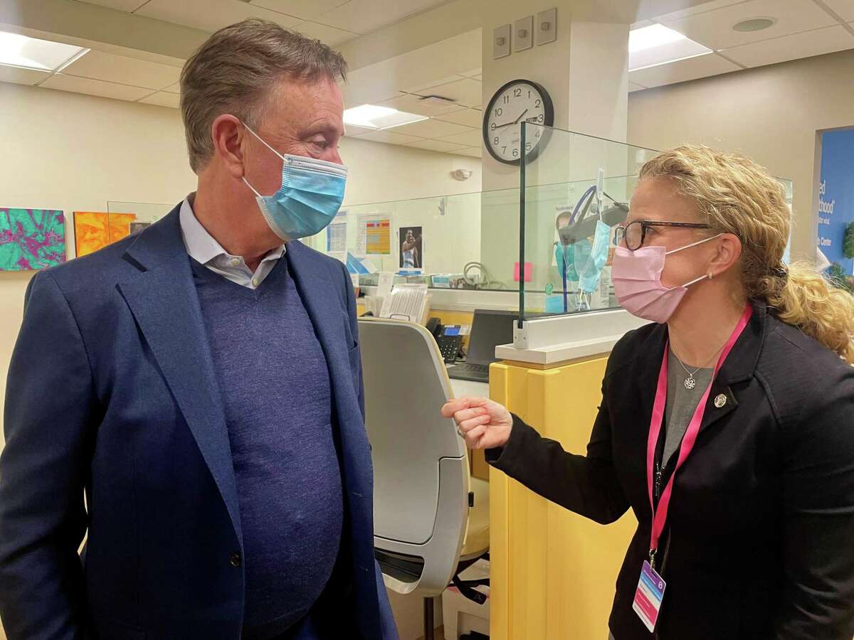 Gov. Ned Lamont talks with Amanda Skinner, president and CEO of Planned Parenthood of Southern New England, at the agency's health center on Albany Avenue in Hartford on March 30, 2022. Lamont visited the facility to reaffirm his support for abortion rights.