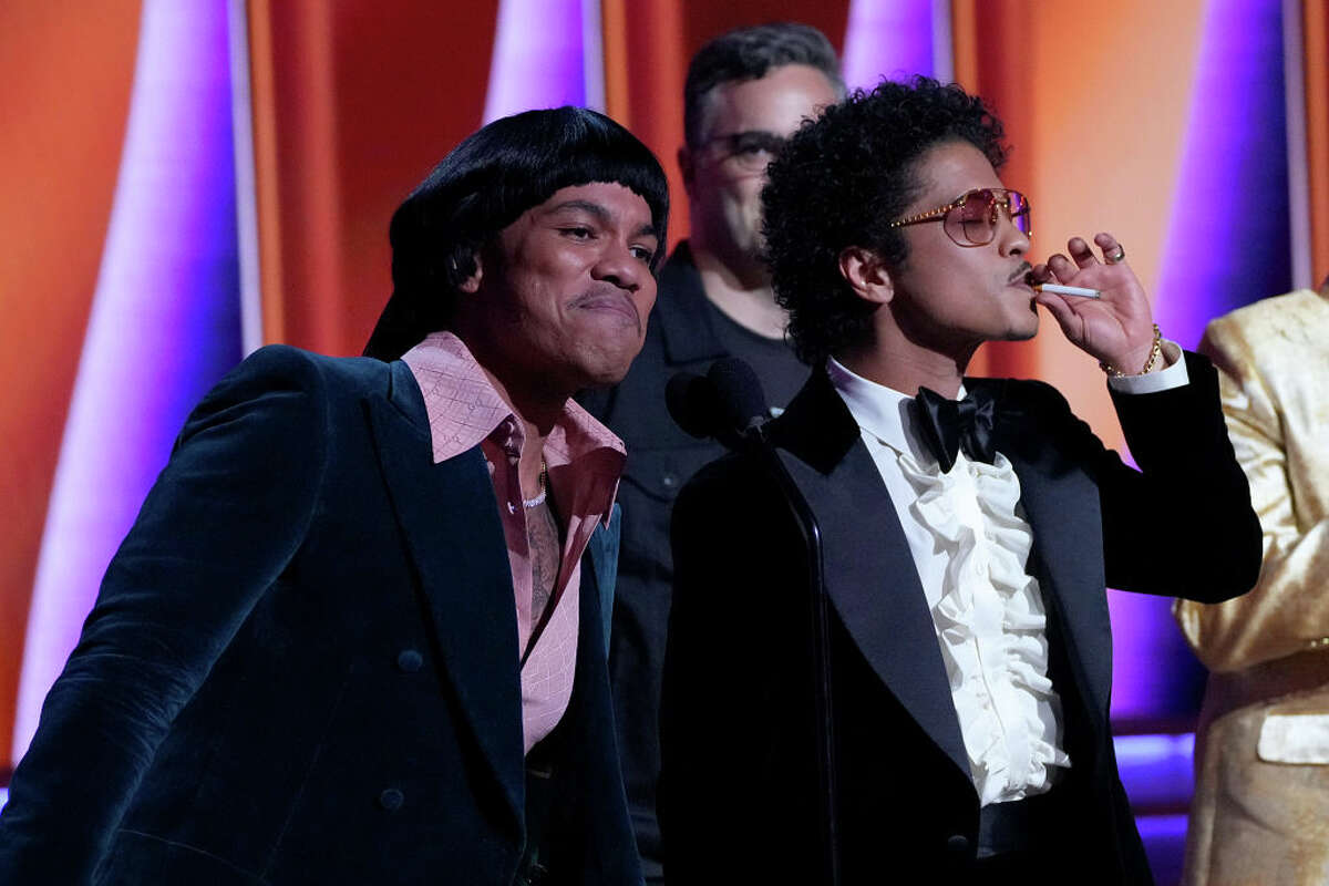 Anderson .Paak and Bruno Mars accept Record Of The Year award for Silk Sonic's "Leave The Door Open" onstage during the 64th Annual GRAMMY Awards at MGM Grand Garden Arena on April 3, 2022 in Las Vegas, Nev. (Photo by Kevin Mazur/Getty Images for The Recording Academy)