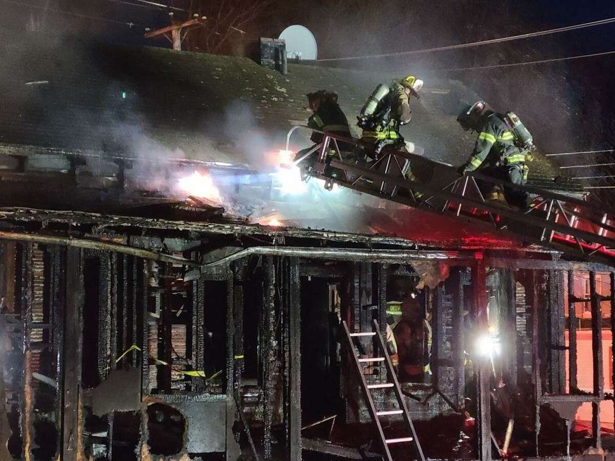 Shelton fire crews battled a three-story structure fire at the corner of Howe Avenue and Maple Street on April 1, 2022.
