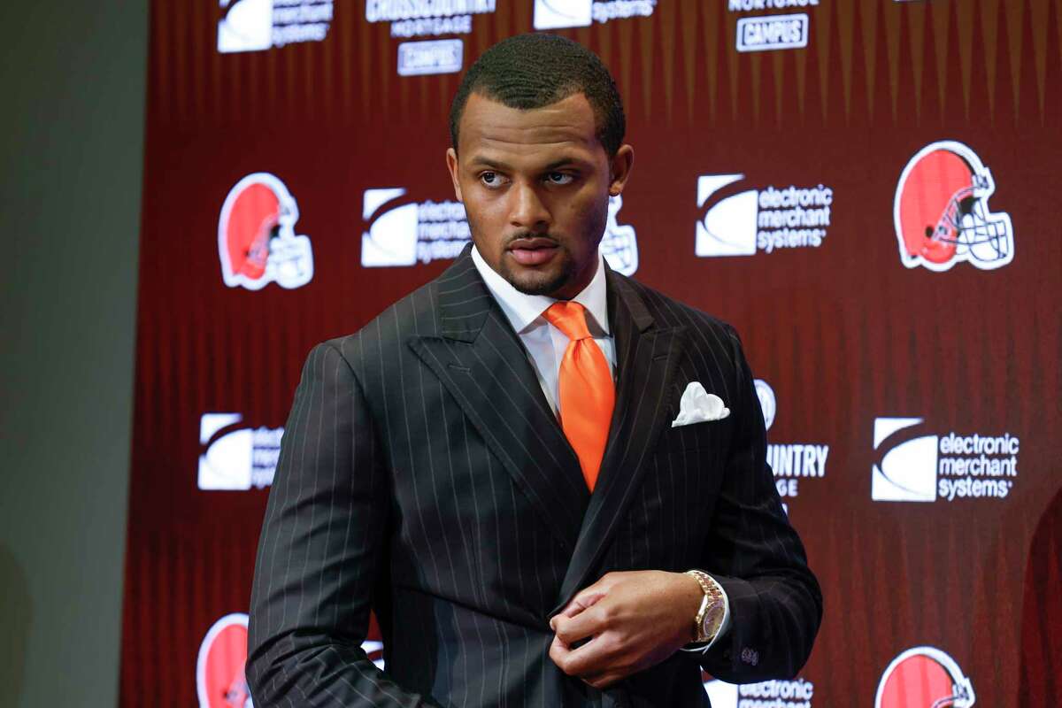 Cleveland Browns new quarterback Deshaun Watson enters a news conference at the NFL football team's training facility, Friday, March 25, 2022, in Berea, Ohio. (AP Photo/Ron Schwane)