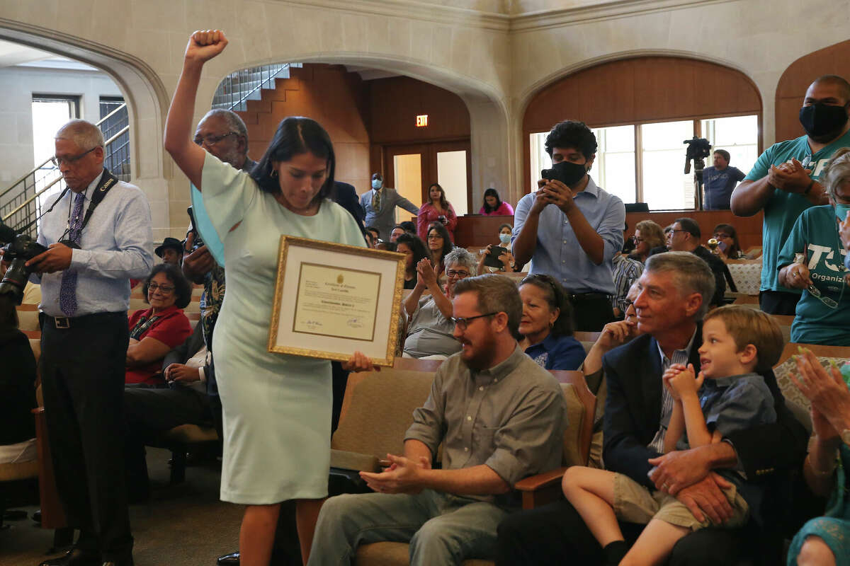 Newly elected San Antonio District 5 City Council member Teri Castillo reacts after receiving her Certificate of Election from Mayor Ron Nirenberg during a swearing-in ceremony on Tuesday, June 15, 2021.