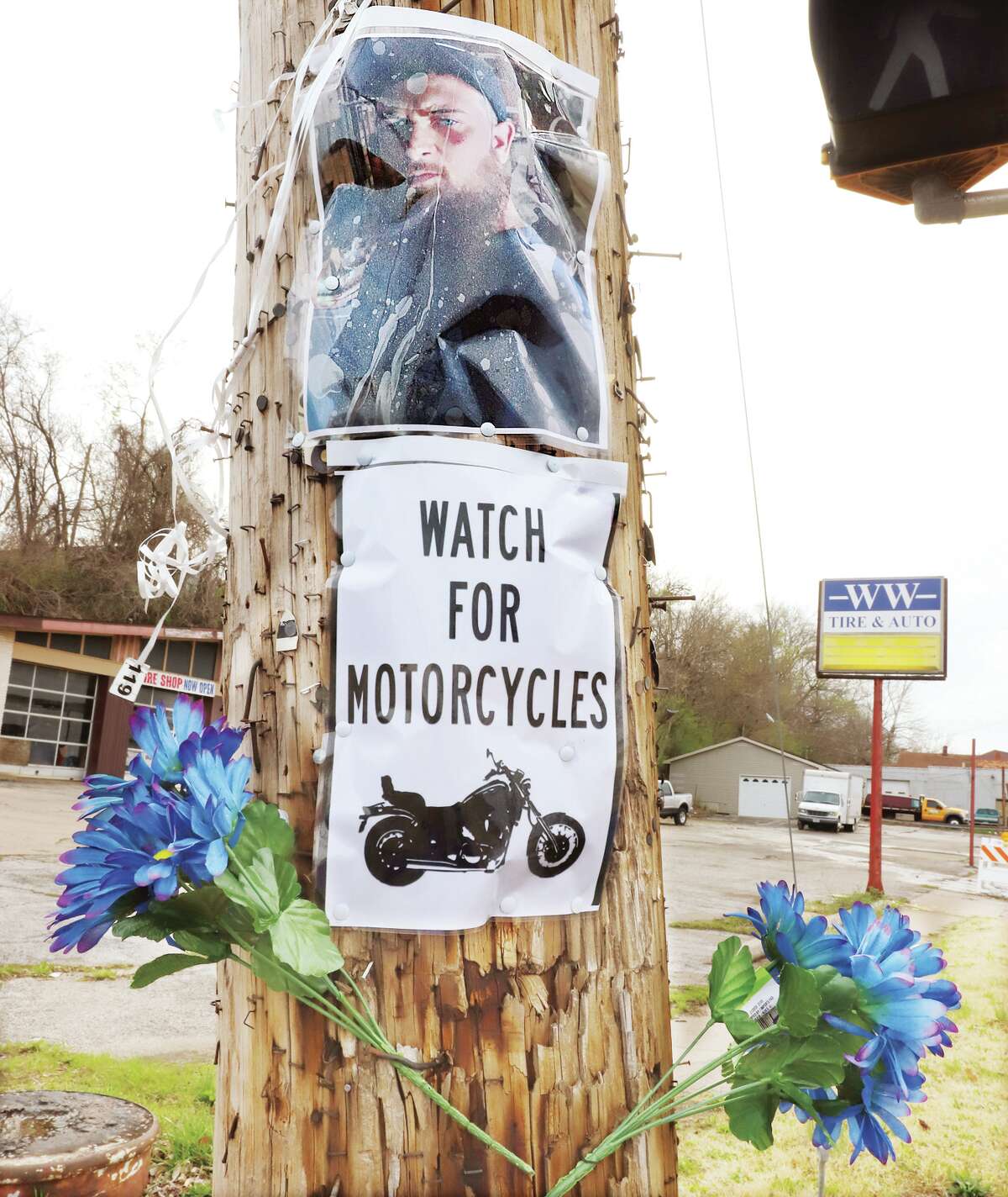 John Badman|The Telegraph Part of a memorial for motorcyclist Nicholas West of Wood River hangs from a pole at the intersection of East Broadway and Main Street in Alton Monday following his death Saturday morning in a collision between his motorcycle and flat lumber truck.
