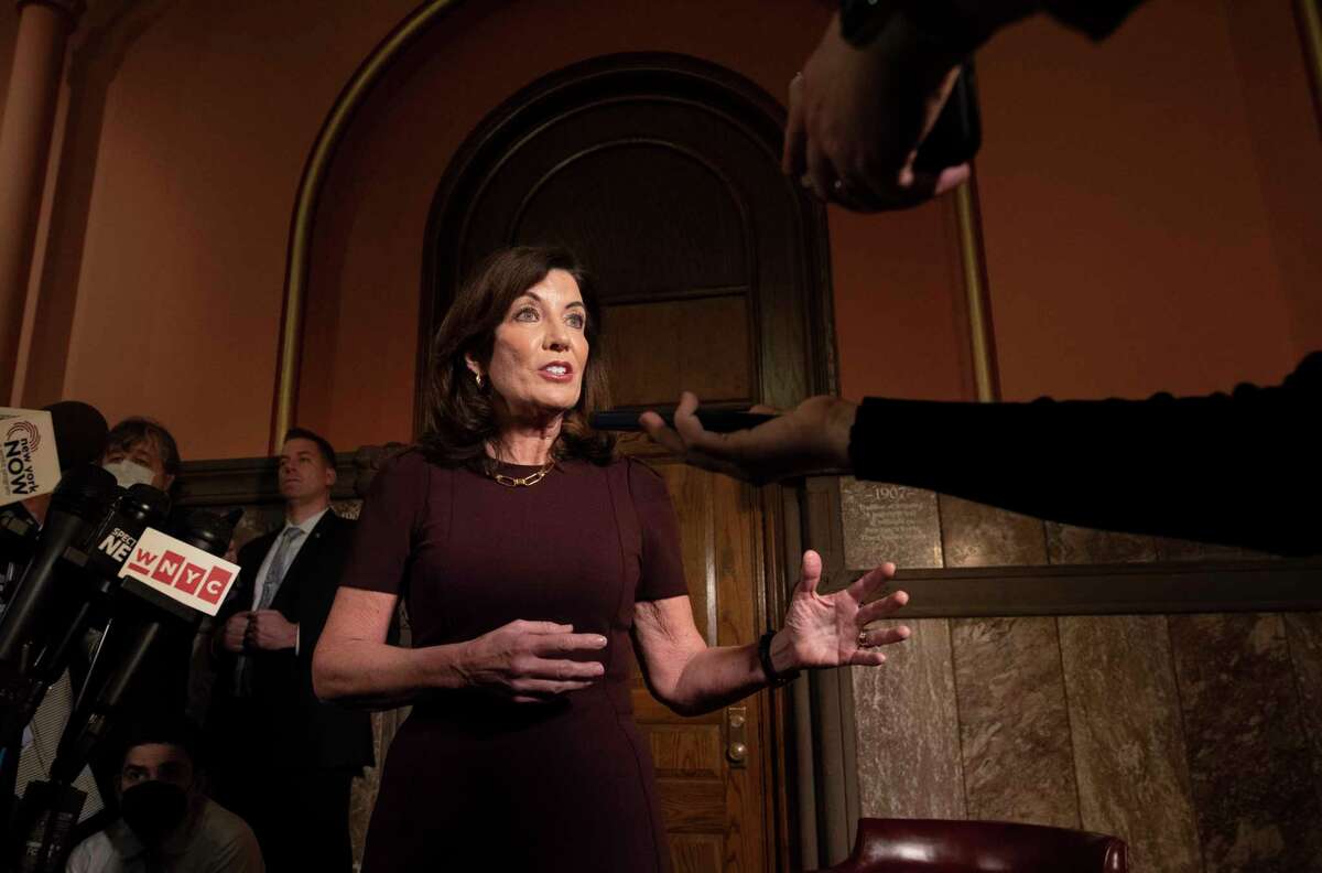Gov. Kathy Hochul speaks to the press about working on passing the budget after she received a COVID booster shot outside her office at the New York State Capitol on Monday, April 4, 2022 in Albany, N.Y.