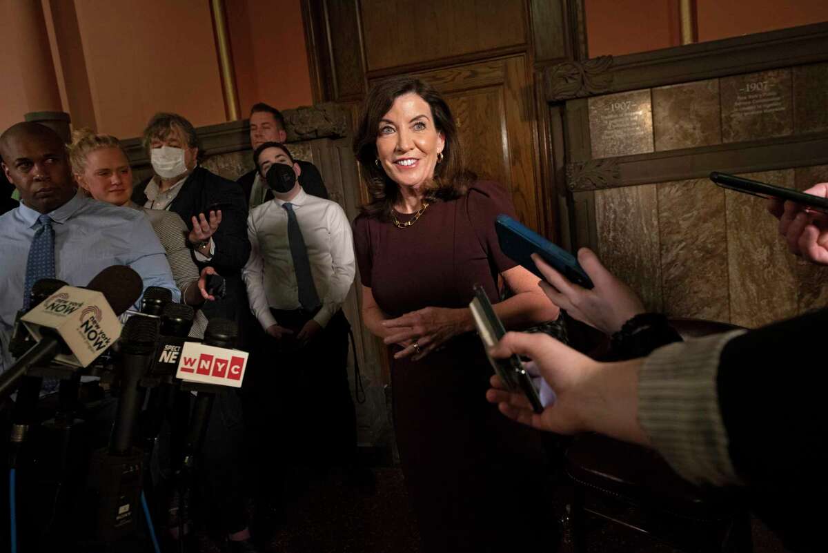 Gov. Kathy Hochul speaks to the press about working on passing the budget after she received a COVID booster shot outside her office at the New York State Capitol on Monday, April 4, 2022 in Albany, N.Y.