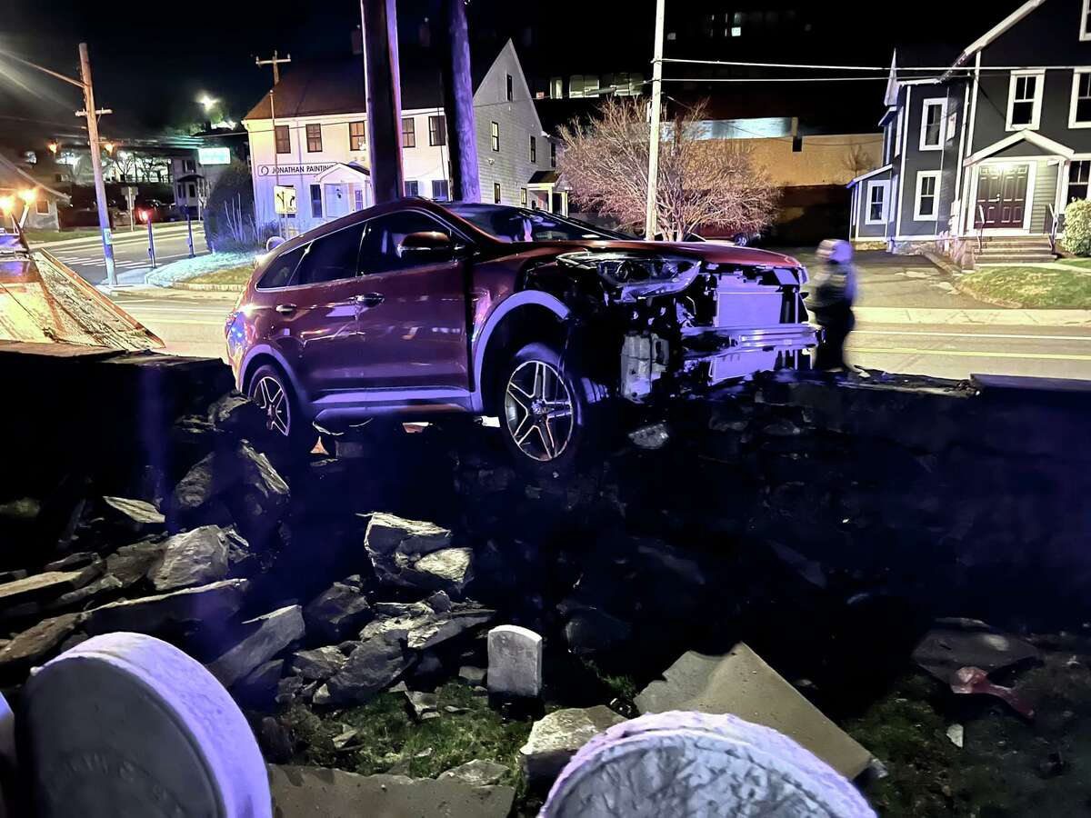 A historic cemetery and its surrounding wall in Norwalk were damaged Saturday, April 2, 2022 when a car struck the wall, which dates back to the 1700s.