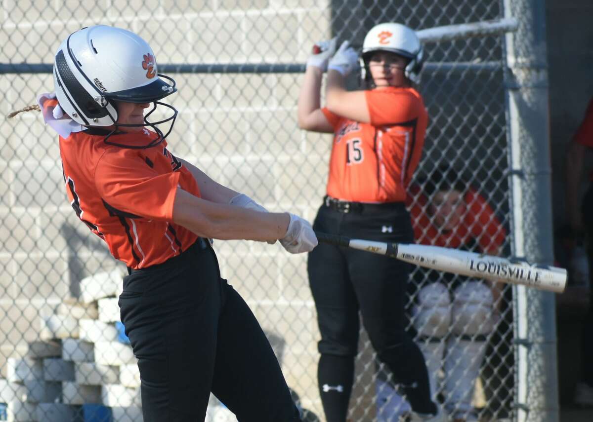 Edwardsville's Emily Wolff hits an RBI single against the Alton Redbirds on Monday in Southwestern Conference action in Godfrey.