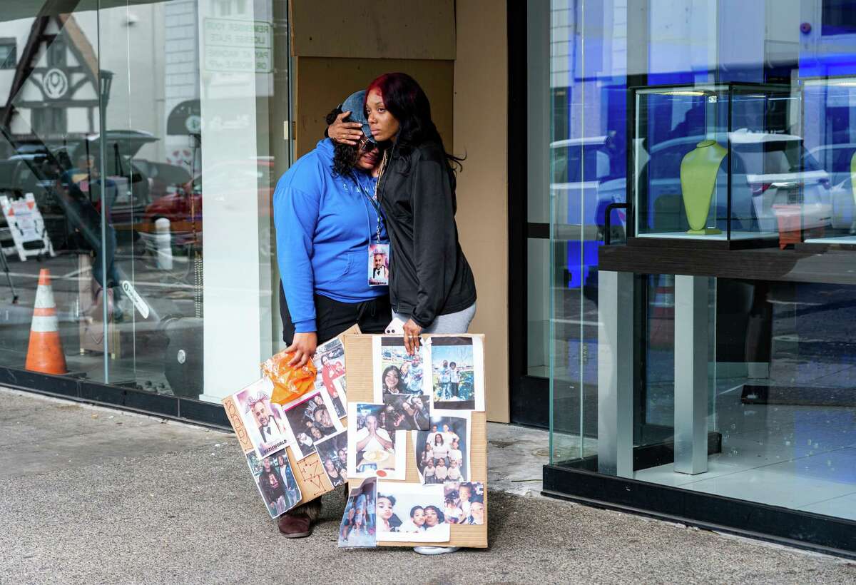 Patricia Powell (L), the sister of Devazia Turner, one of the victims of the mass shooting, is comforted by Sierra Mathis (R), Devazia’s fiancee, on April 4, 2022. The shooting took place on 10th and K streets near the State Capitol killed six people and 12 others were wounded.