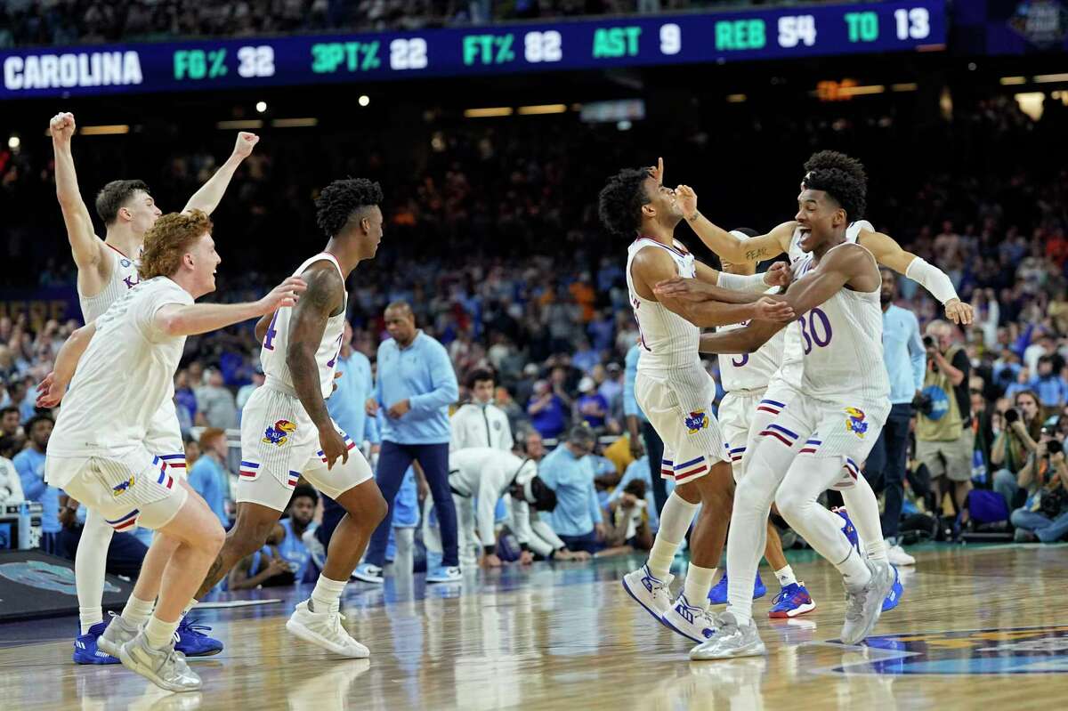 Kansas players after their win against North Carolina in a college basketball game in the finals of the Men's Final Four NCAA tournament, Monday, April 4, 2022, in New Orleans. (AP Photo/David J. Phillip)
