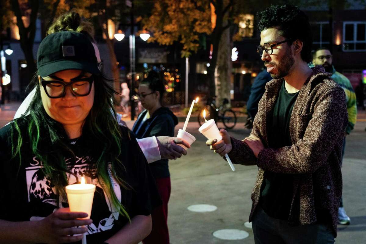 Community members attend a candlelight vigil on Seventh and K streets.