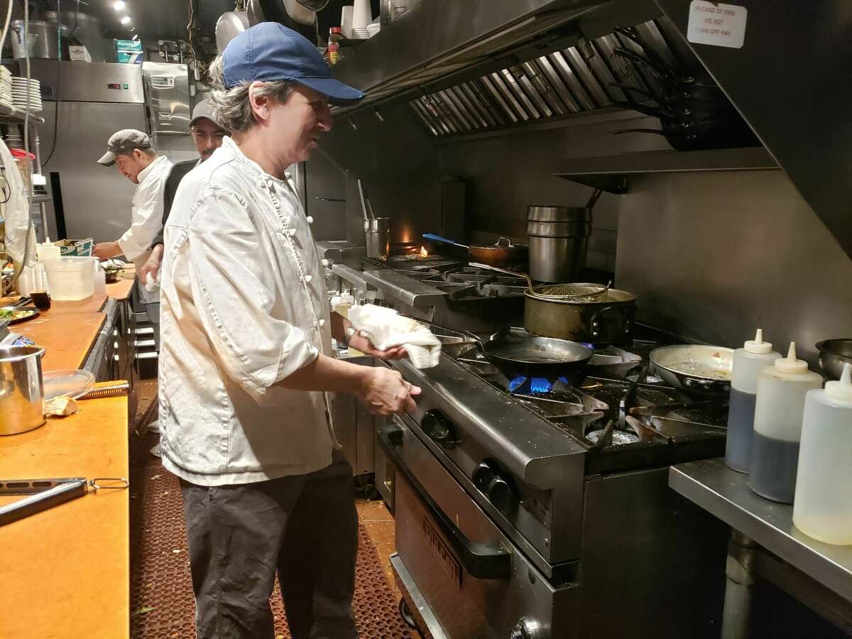 Chef Robert Ubaldo and his crew on the cooking line at the Farmer’s Table in New Canaan as pans sizzled and steamed, sending up an occasional ball of flame. 