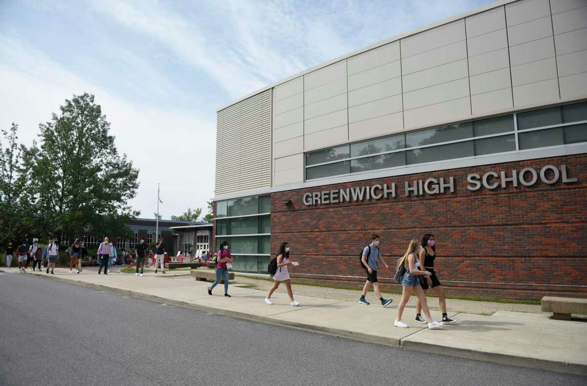 Students from the first cohort are dismissed to make way to the second cohort at Greenwich High School on Wednesday, Sept. 9, 2020.