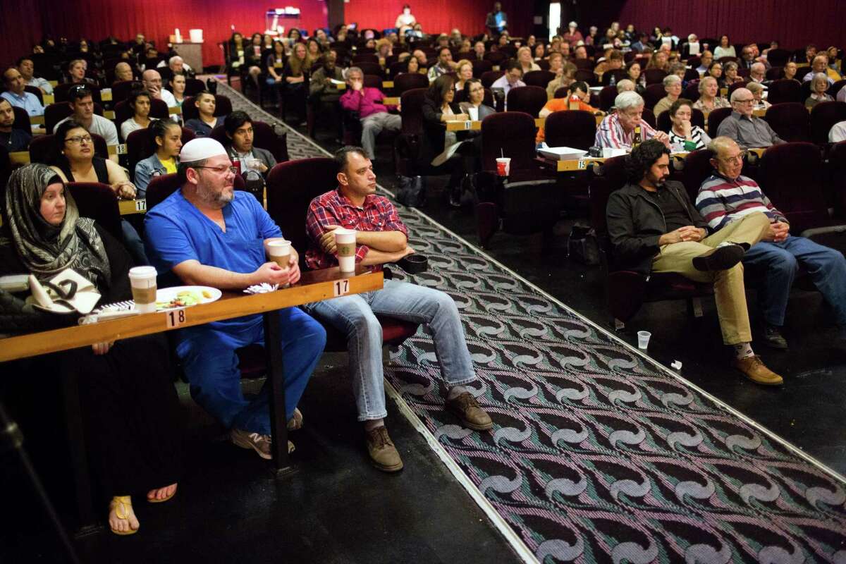 Community members listen during Cultural Conversations: Fairness Forward, an event at the Bijou theater in 2016.