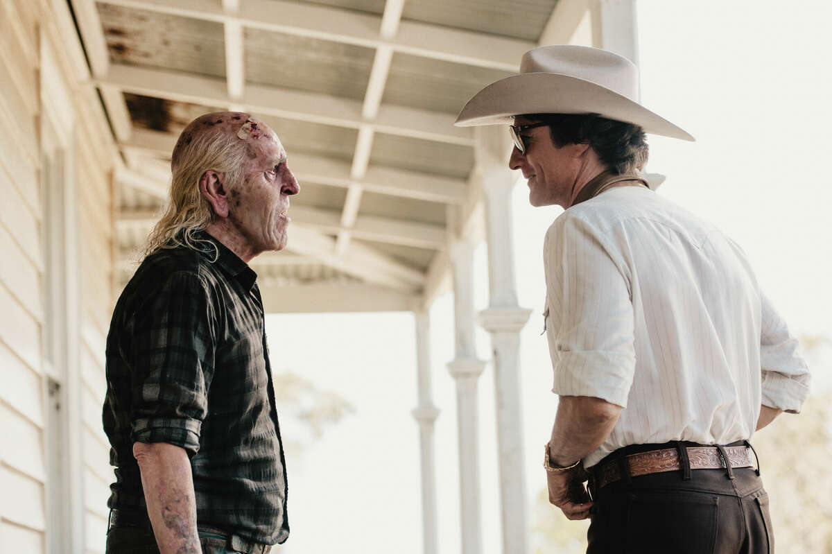 Producer Wayne Gilroy, right, speaks to Howard, left, owner of the rural Texas property where Gilroy plans to make his low-budget adult film.