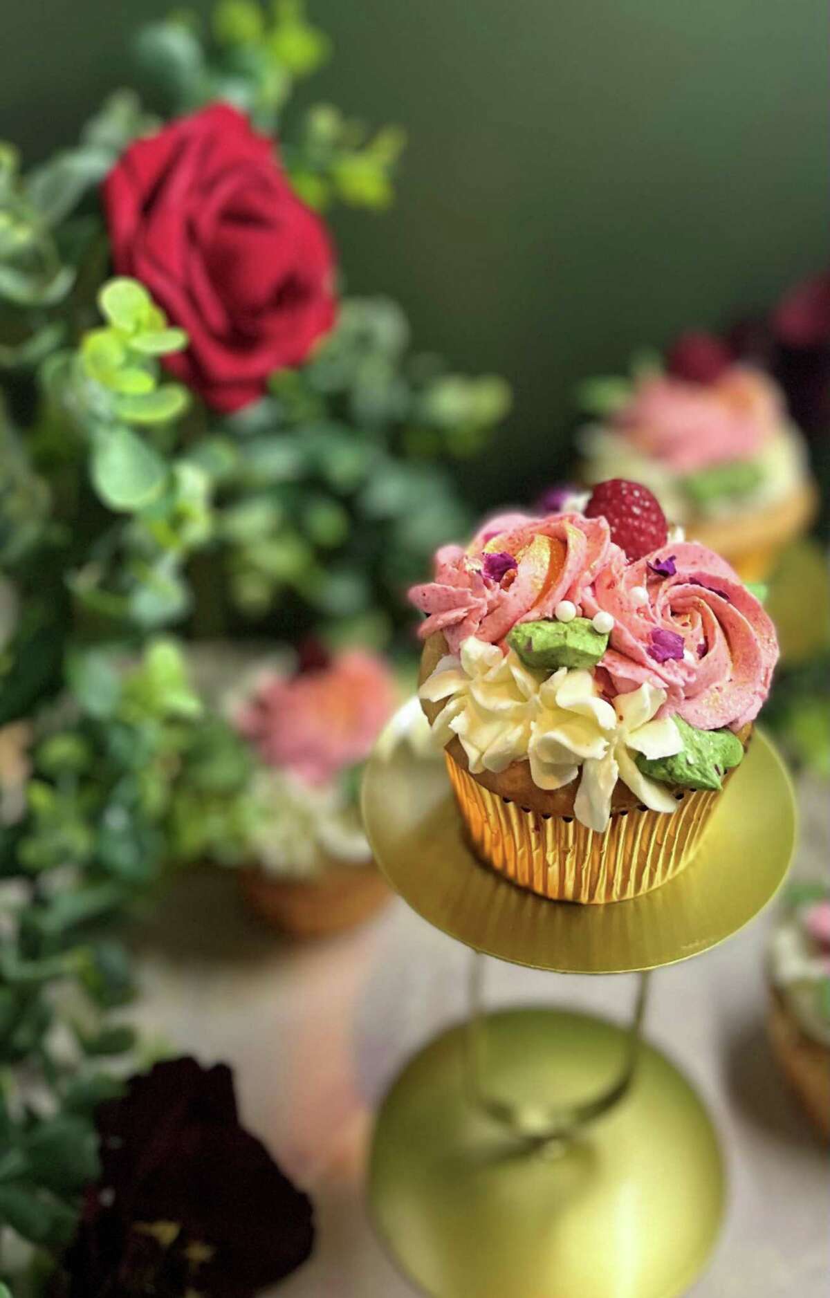 One of the cupcake flavors is Queen Elizabeth. It is rose water, raspberry, mint, honey, and chamomile. May 1 is the soft opening, and May 2 is the grand opening of Je T'aiMe Cupcakes and Cocktails in the Connecticut Post Mall.