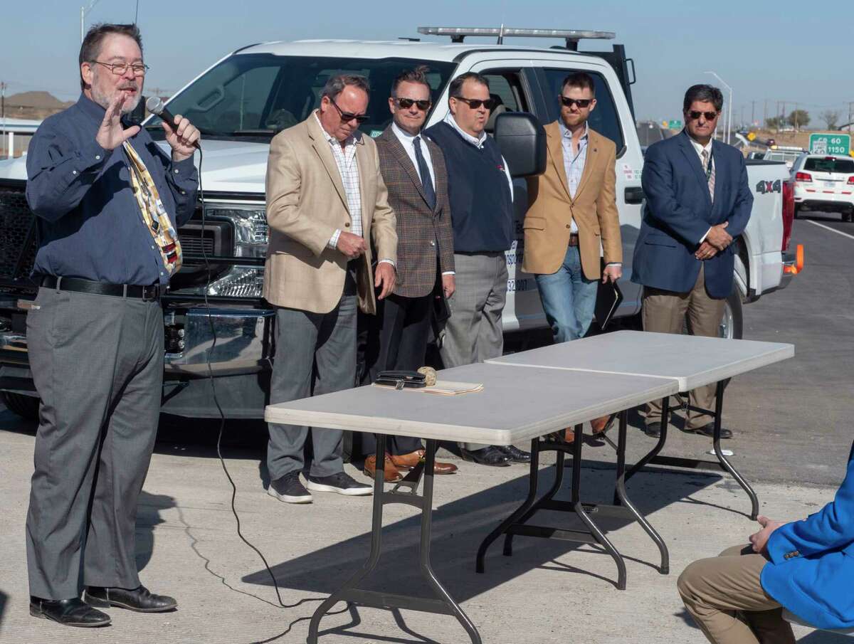 Gene Powell, with TXDOT, welcomes everyone to a ceremony on Loop 250 at the newly constructed overpass over County Road 1140 in this photo from April 5. Tim Fischer/Reporter-Telegram
